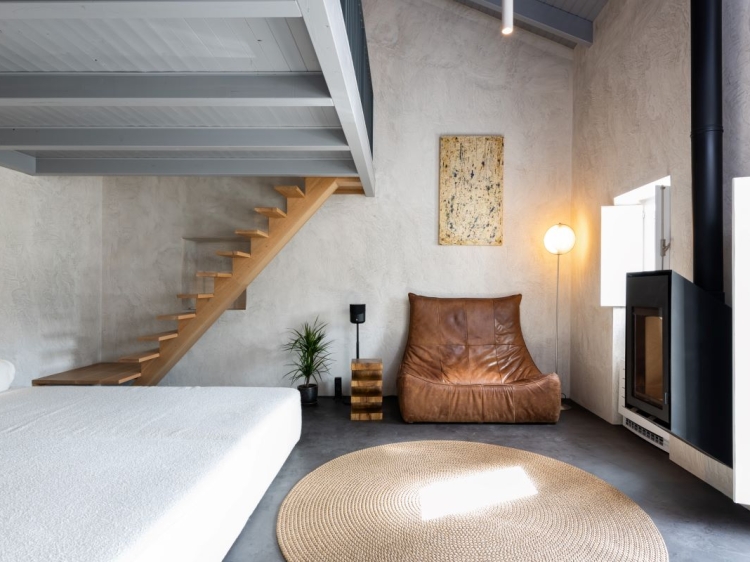 Living room with vintage sofa and wood burner